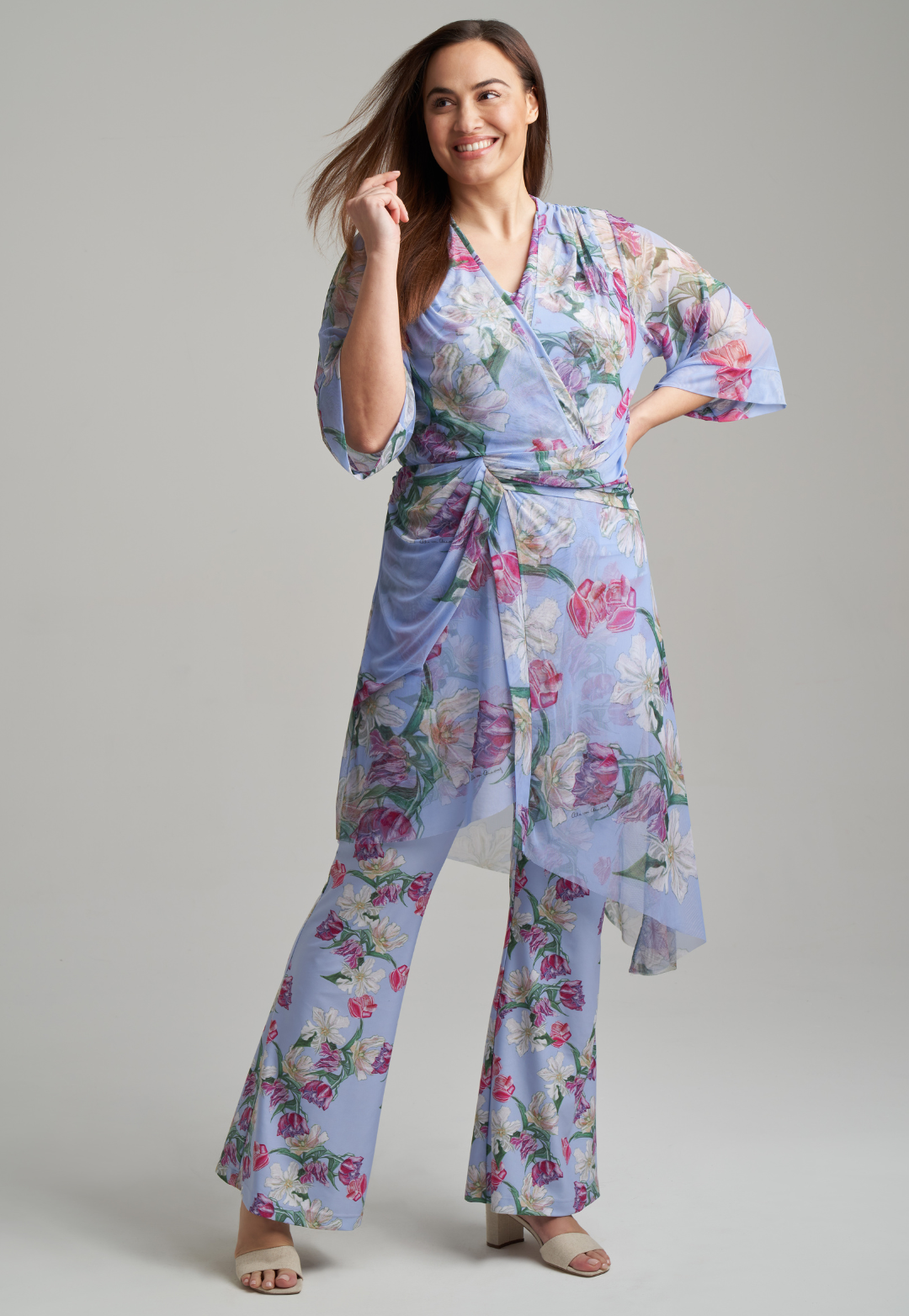 woman wearing stretch knit tank top and stretch knit pants in tulip print with mesh tulip printed kimono on top by Ala von Auersperg for spring summer 2021