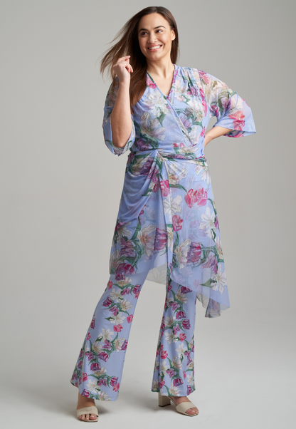 woman wearing stretch knit tank top and stretch knit pants in tulip print with mesh tulip printed kimono on top by Ala von Auersperg for spring summer 2021