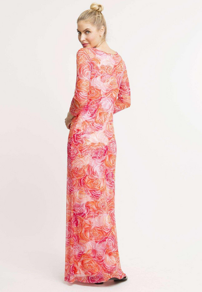 Woman wearing a pink and orange flower printed mesh cowl neck dress layered over long orange and pink flower printed stretch knit dress by Ala von Auersperg