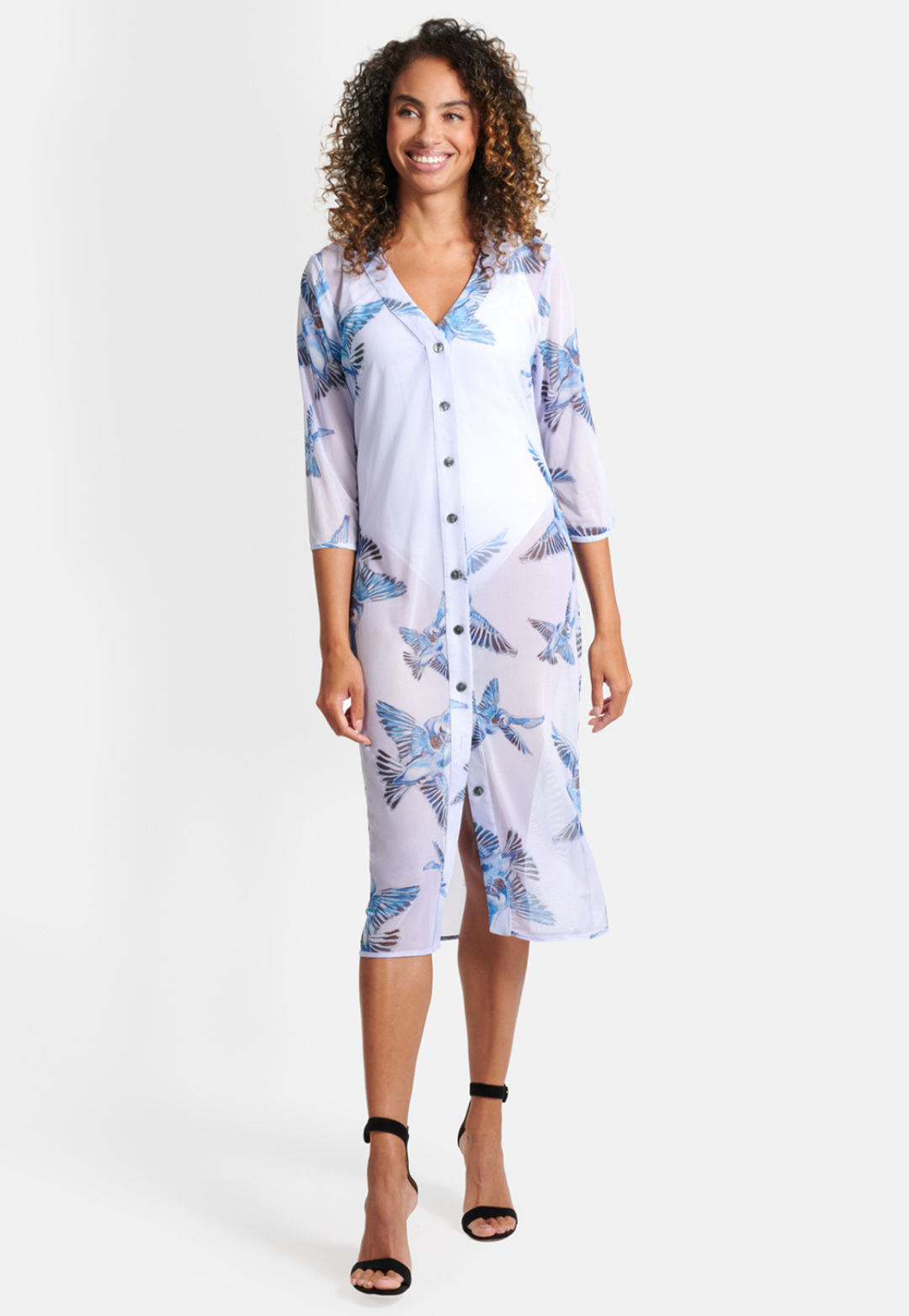 Woman wearing love birds printed lavender mesh cardigan with three quarter sleeves and button down front over a bathing suit by Ala von Auersperg