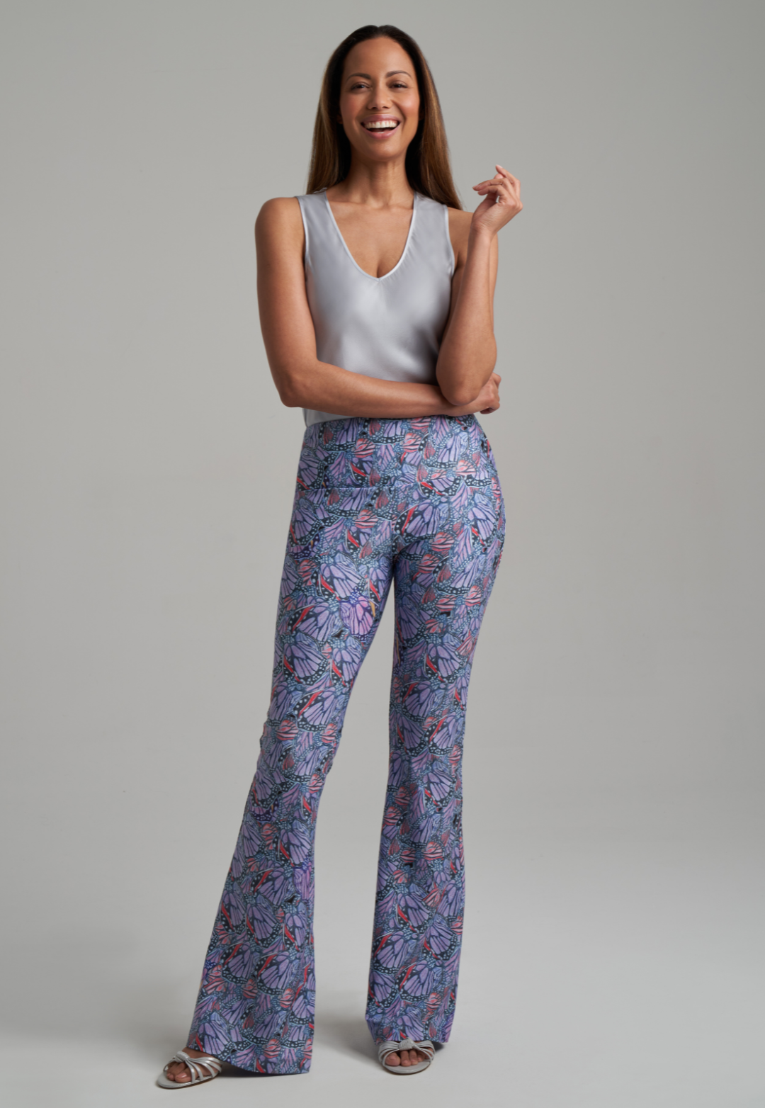 Woman wearing butterfly printed stretch knit purple pants by Ala von Auersperg for spring summer 2021