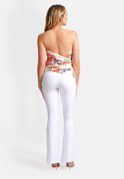 Model wearing silk orange and white flower printed halter top with long tie
