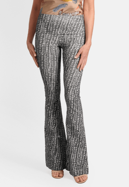 Model wearing black and white dotted stretch corduroy flare pants