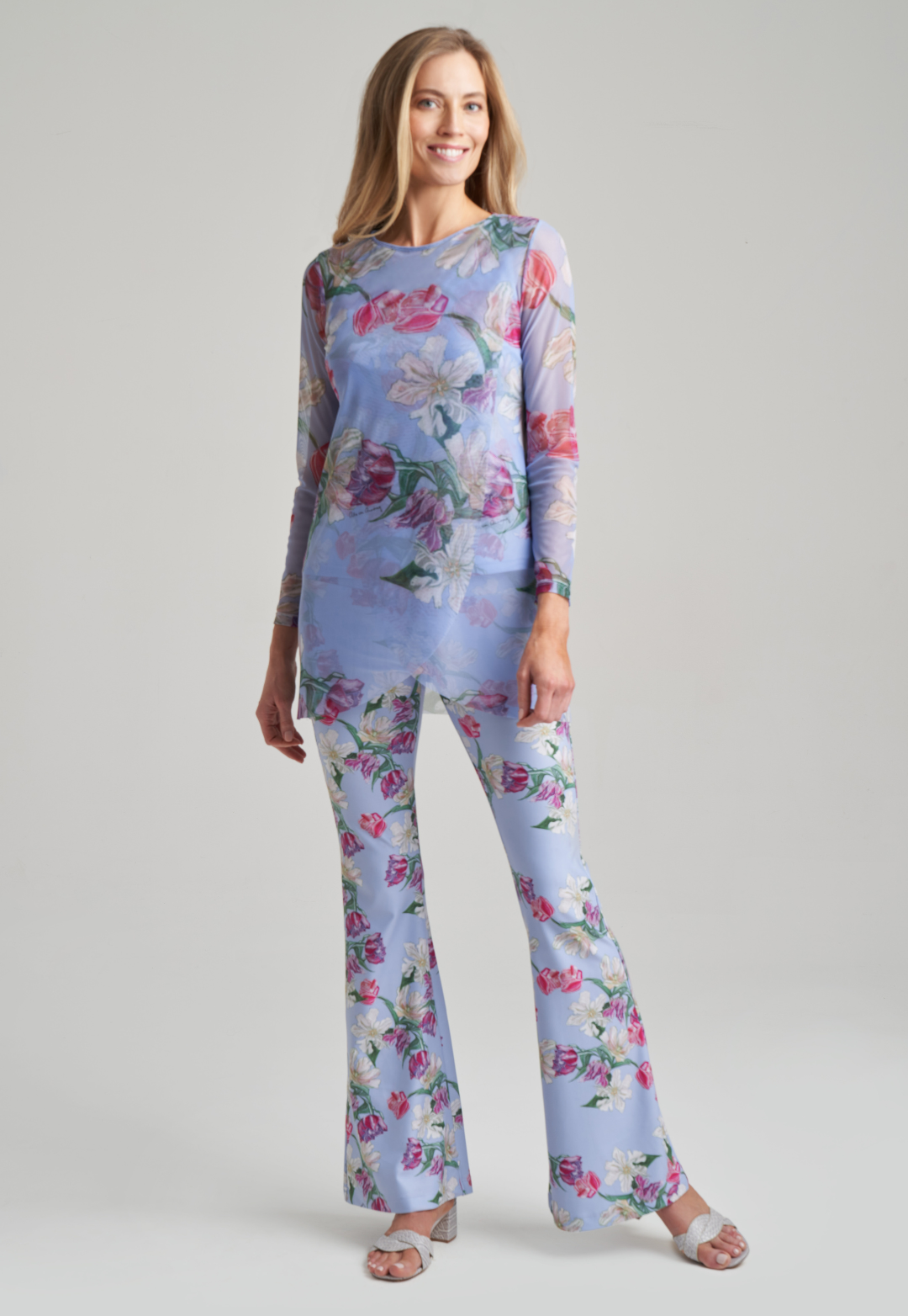 woman wearing stretch knit tank top and stretch knit pants in tulip print with mesh tulip printed tunic by Ala von Auersperg for spring summer 2021
