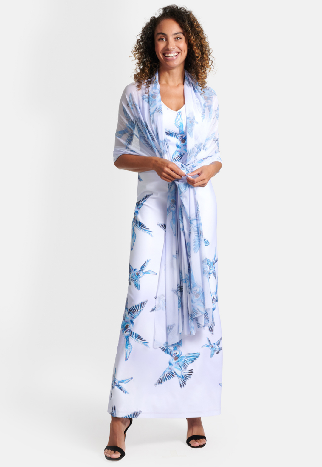 Woman wearing long stretch knit v neck printed love birds lavender long dress with mesh gala wrap shawl by Ala von Auersperg