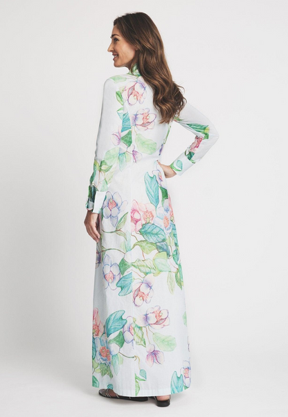 Woman wearing blue and green flower printed cotton long shirt dress by Ala von Auersperg