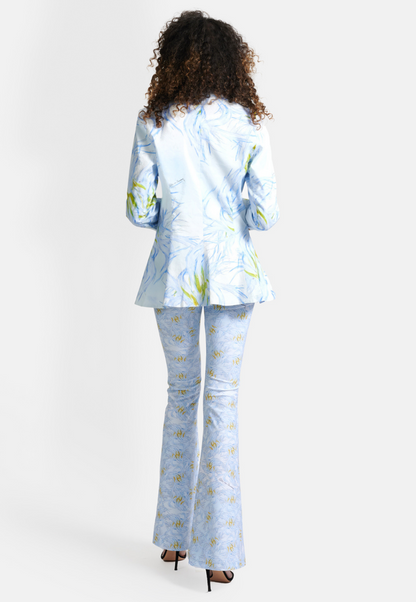 Woman wearing blue feather printed cotton blazer over stretch knit tank top and pants by Ala von Auersperg
