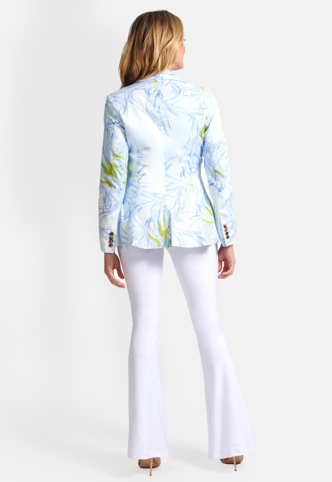 woman wearing blue and yellow feather printed cotton blazer by Ala von Auersperg