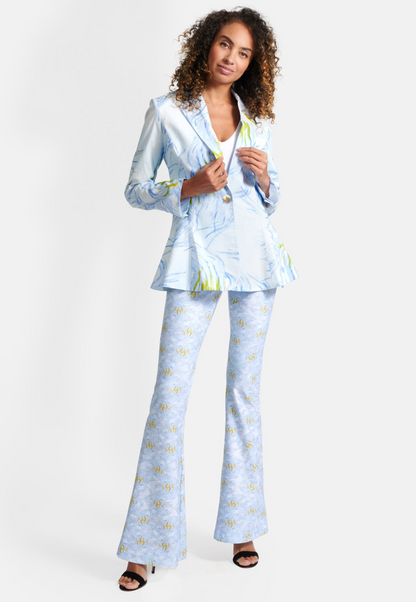 Woman wearing blue feather printed cotton blazer over stretch knit tank top and pants by Ala von Auersperg