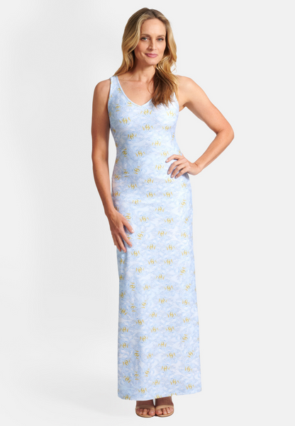 Woman wearing blue and yellow feather printed stretch knit long dress by Ala von Auersperg