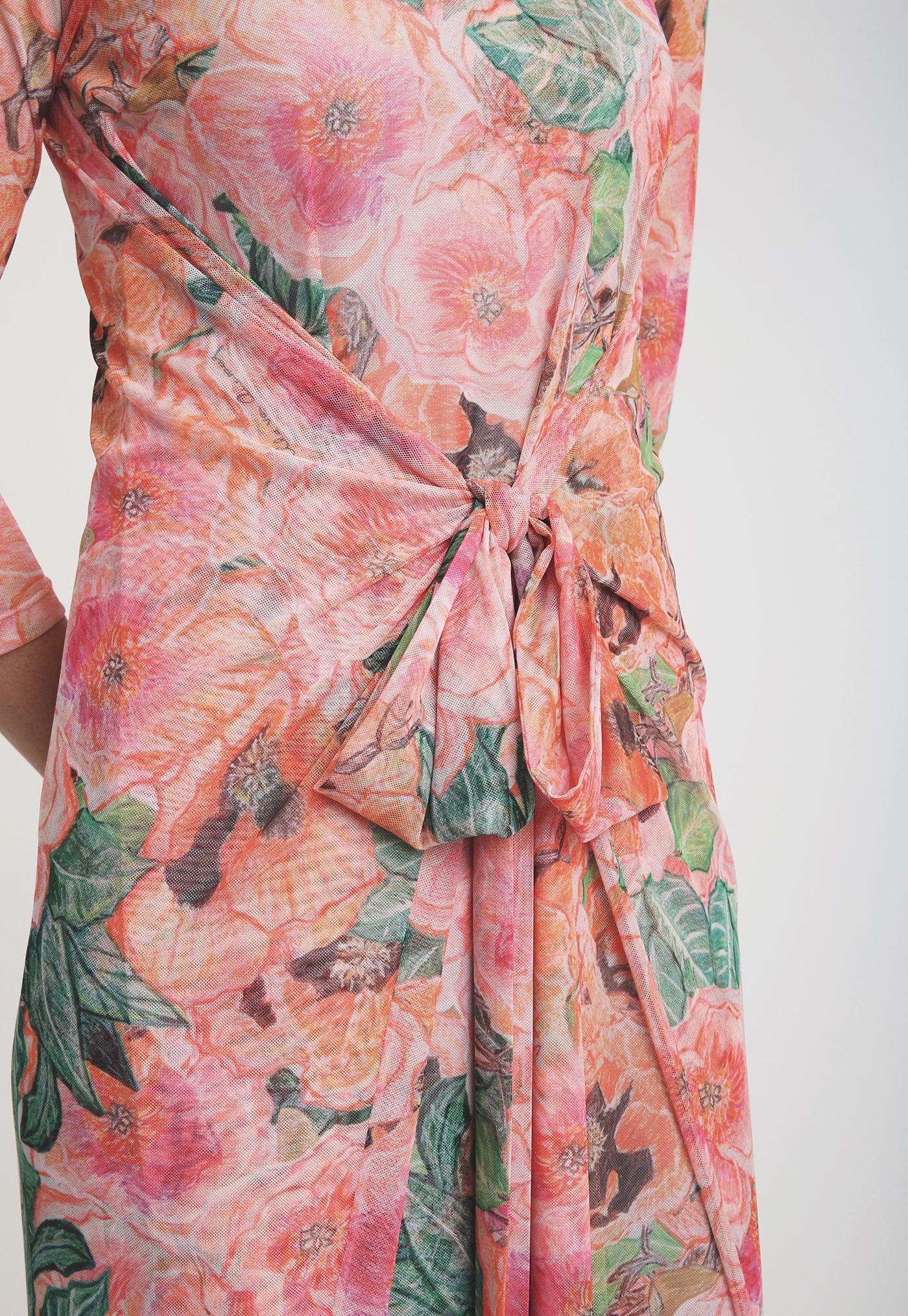 pink and orange floral printed mesh wrap dress layered over long pink and orange long stretch knit dress