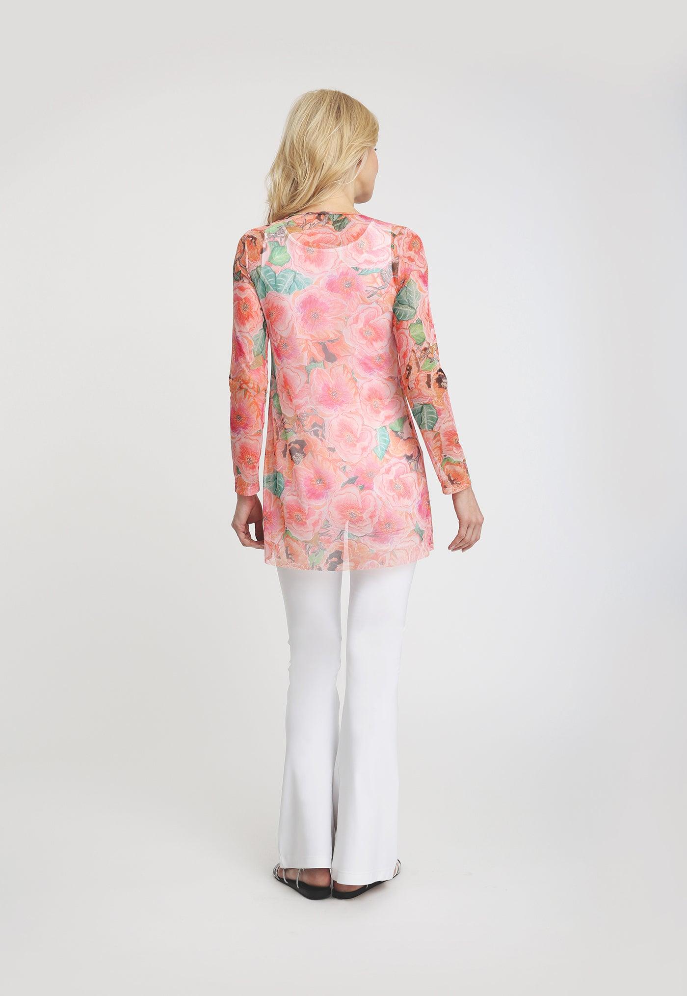 pink and orange flower printed mesh tunic top with white stretch knit pants